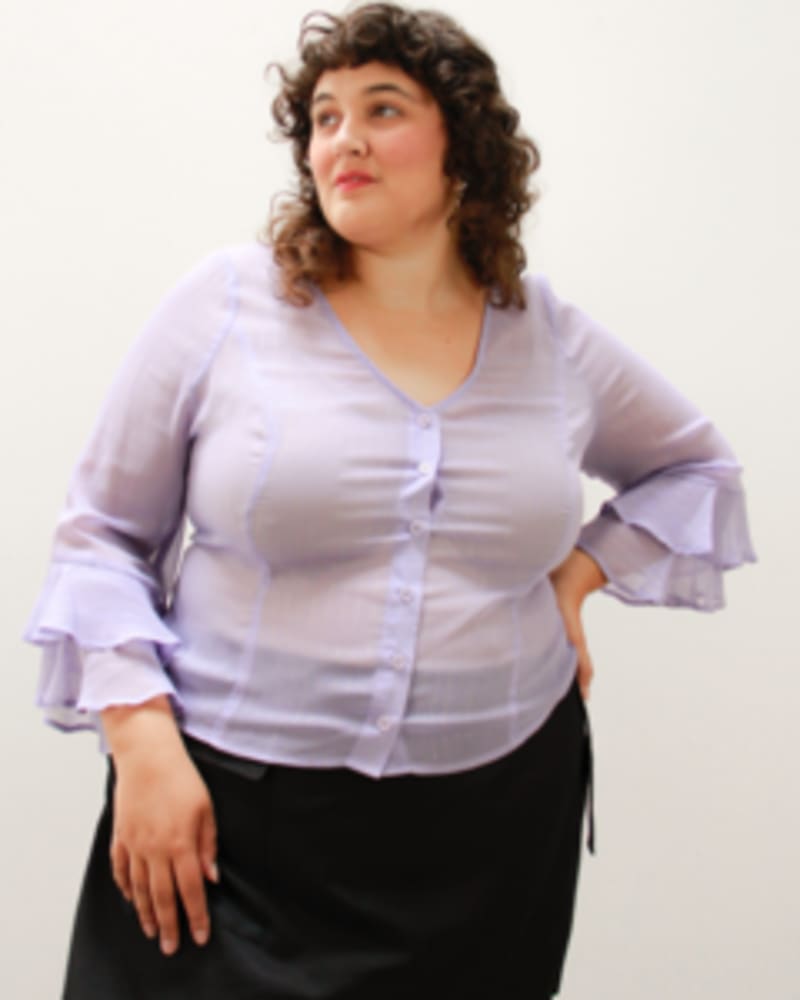 Front of a model wearing a size L Martha Ruffle-Sleeve Top in Lilac Shimmer by Lovefool. | dia_product_style_image_id:249646